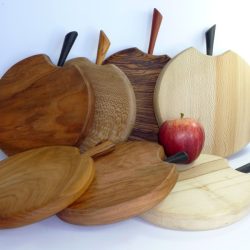 Hand made hand cut single piece wooden chopping boards with stalk detail in selection of woods